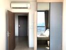 Bedroom with air conditioner and wardrobe