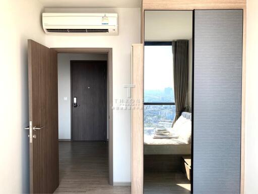 Bedroom with air conditioner and wardrobe