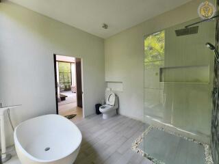 Modern bathroom with standalone tub and walk-in shower