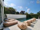 Outdoor pool area with lounge seating