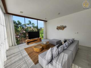 Spacious living room with modern furniture and large windows