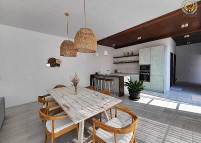 Spacious kitchen and dining area with natural lighting