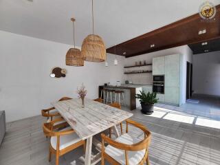 Spacious kitchen and dining area with natural lighting