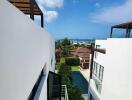 View from a modern building towards a residential neighborhood and sea