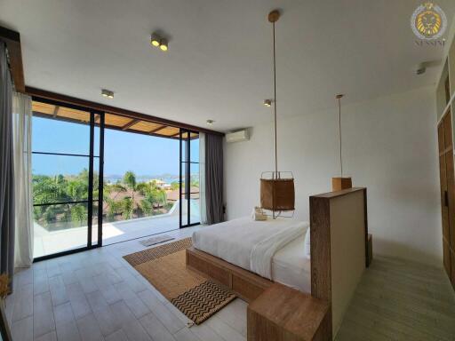 Spacious bedroom with large windows and beautiful view