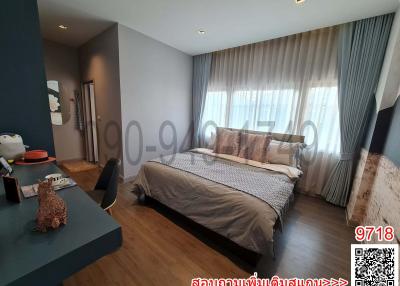 Spacious bedroom with large bed, modern design, and ample natural light