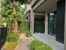 Contemporary house exterior with walkway and patio