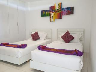Bright and colorful twin bedroom with modern decor