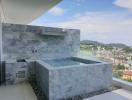Luxurious balcony with marble finish and private jacuzzi overlooking cityscape