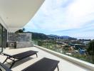 Spacious balcony with panoramic view and sun loungers