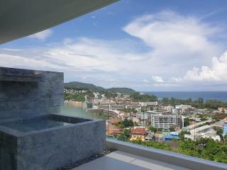 Panoramic view from a modern balcony overlooking the city and sea