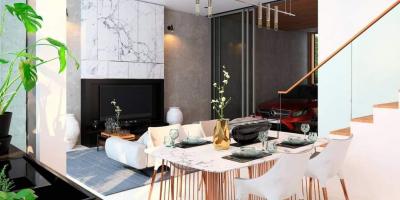 Elegant modern living space with combined dining area, fireplace, and a view of the garage with a red car