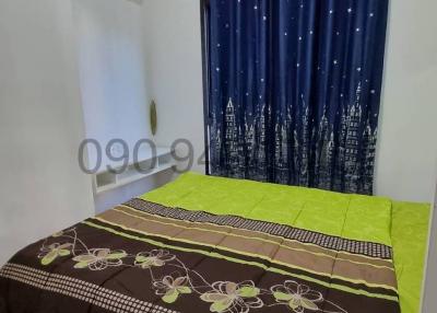 Cozy bedroom with air conditioning and star-themed curtains