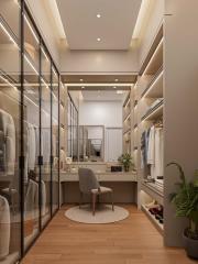 Elegant walk-in closet with vanity table and ample storage space in a modern bedroom