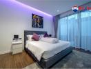 Modern bedroom with comfortable bedding, ambient lighting, and hardwood floors