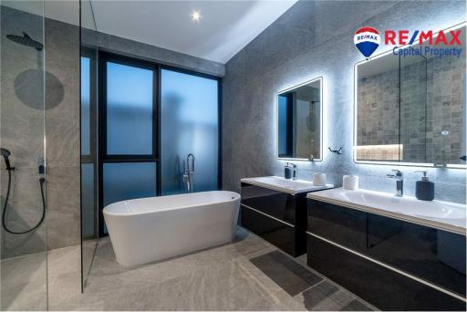 Modern bathroom with freestanding bathtub and walk-in shower