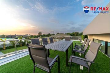 Spacious terrace with dining set and sunset view