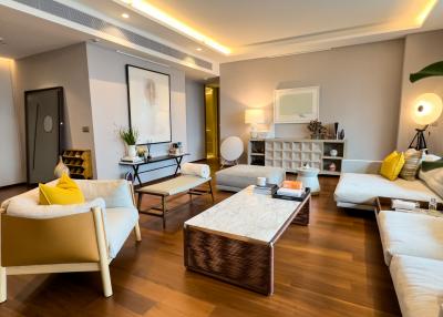 Elegant and spacious living room with modern furniture and ample lighting