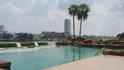 Luxurious outdoor swimming pool with a city skyline view