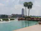 Luxurious outdoor swimming pool with a city skyline view