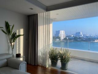 Bright and spacious living room with a view of the city skyline