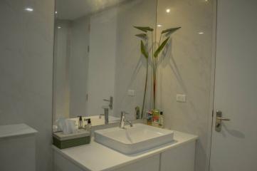 Modern bathroom interior with white basin and accessories