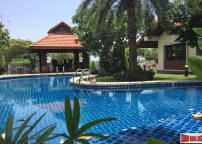 A private compound with a pool villa, a second house and more in Nakhon Pathom.