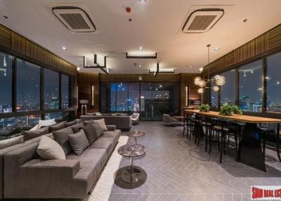 Chewathai Residence Asoke  Brightly Decorated City View Condo with Loft-style Bedroom near MRT Rama 9