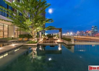 Chewathai Residence Asoke  Brightly Decorated City View Condo with Loft-style Bedroom near MRT Rama 9