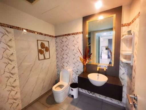 Modern bathroom interior with marble tiles and elegant fixtures