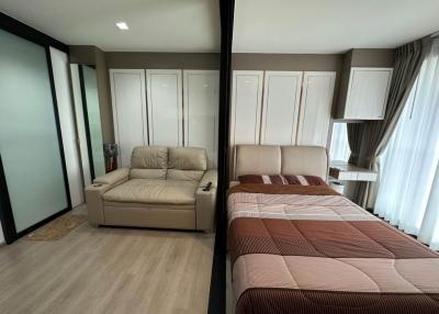 Modern bedroom with a comfortable bed and sliding wardrobe doors