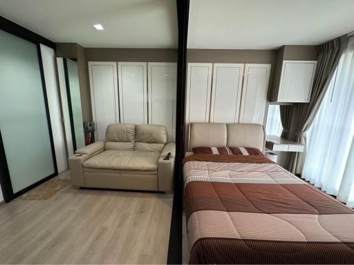 Modern bedroom with a comfortable bed and sliding wardrobe doors