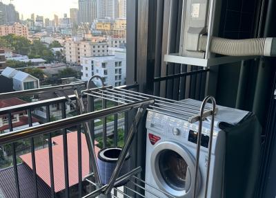Urban apartment balcony with washing machine and air conditioning unit