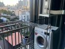 Urban apartment balcony with washing machine and air conditioning unit