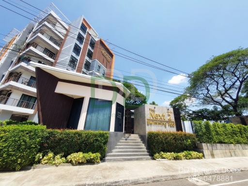 Modern residential building exterior with clear blue sky