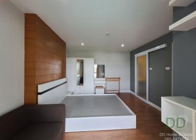 Spacious modern bedroom with en-suite bathroom and balcony access