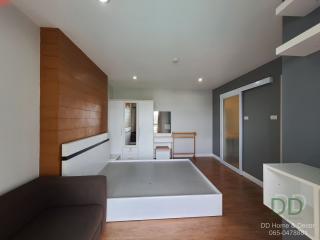 Spacious modern bedroom with en-suite bathroom and balcony access