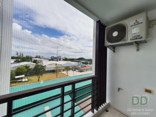 Balcony View Overlooking Community with Clear Blue Skies