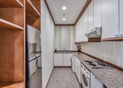 Modern kitchen with stainless steel appliances and granite countertops