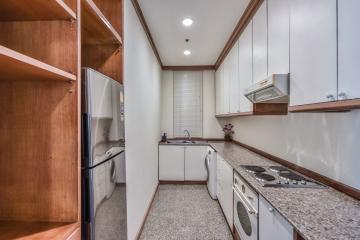 Modern kitchen with stainless steel appliances and granite countertops