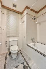 Modern bathroom interior with toilet and bathtub