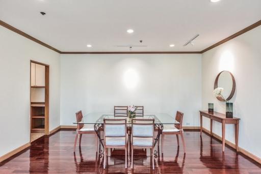 Spacious dining room with hardwood floors and contemporary furniture