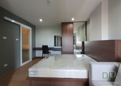Modern bedroom with attached bathroom and office space