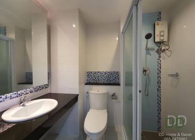 Modern bathroom with shower enclosure and white fittings