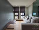 Modern living room with comfortable seating and abundant natural light