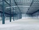 Spacious empty industrial warehouse with metal structure