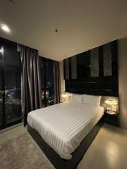 Modern bedroom interior with a view at night