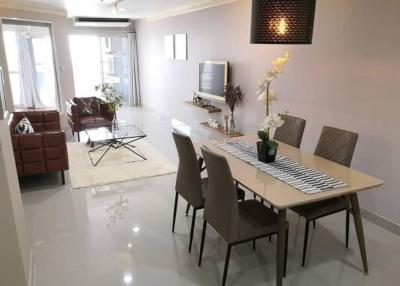 Modern living room with dining area and sleek design