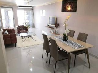 Modern living room with dining area and sleek design