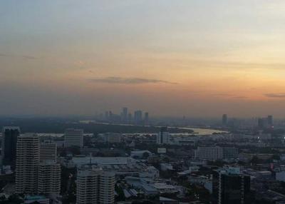 Scenic sunset cityscape with buildings and water views